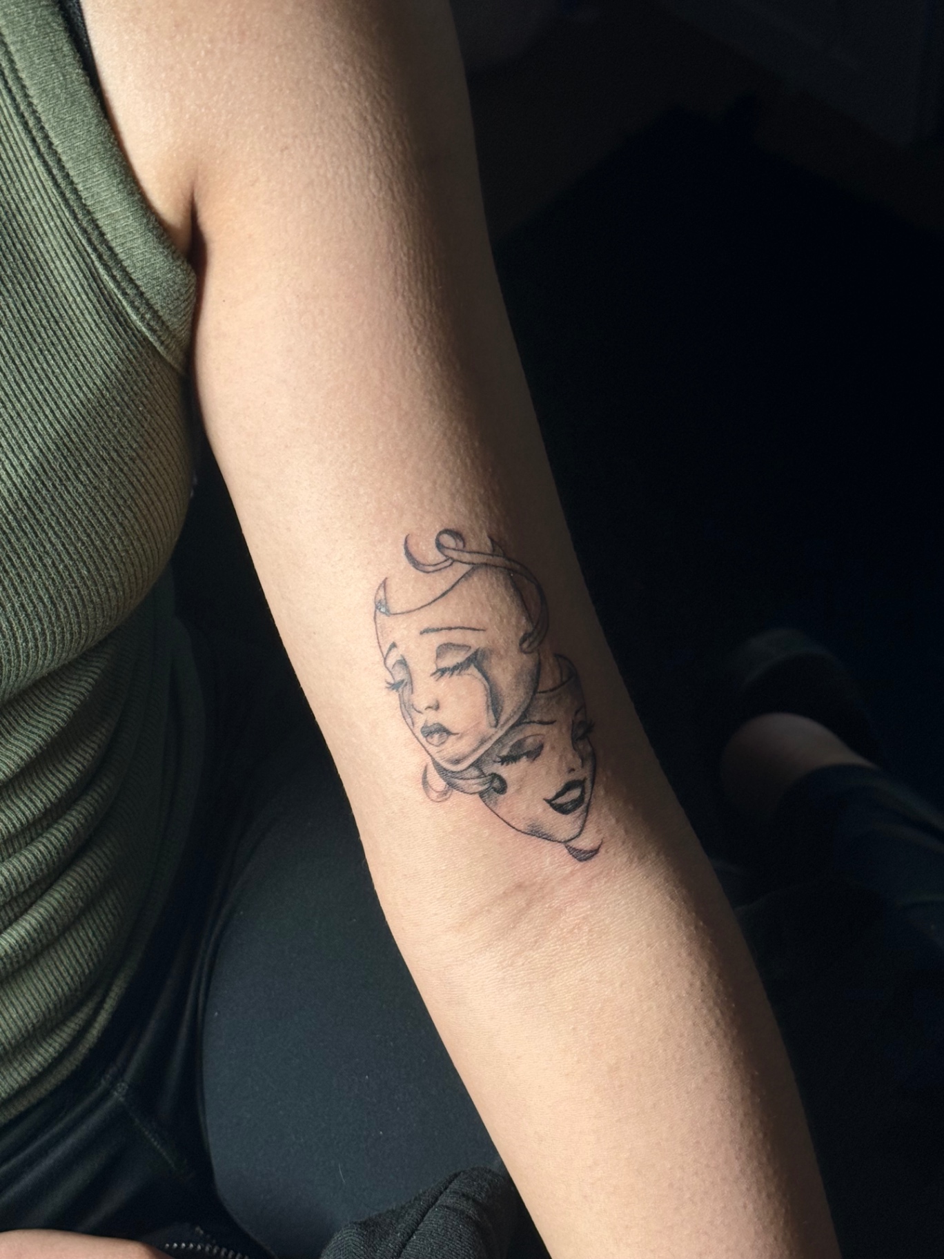 Black and grey comedy and tragedy masks tattoo