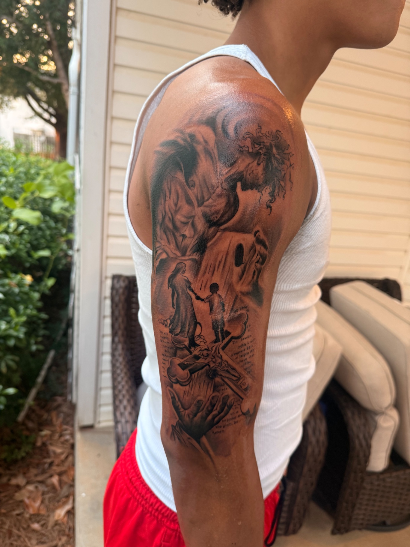 Black and grey realism story sleeve tattoo